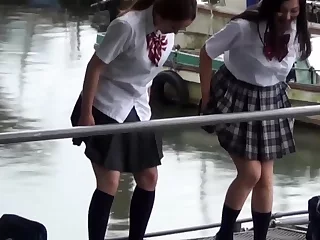 Asian students pissing outdoors
